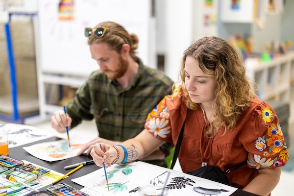 Artist painting in studio at Artspace
