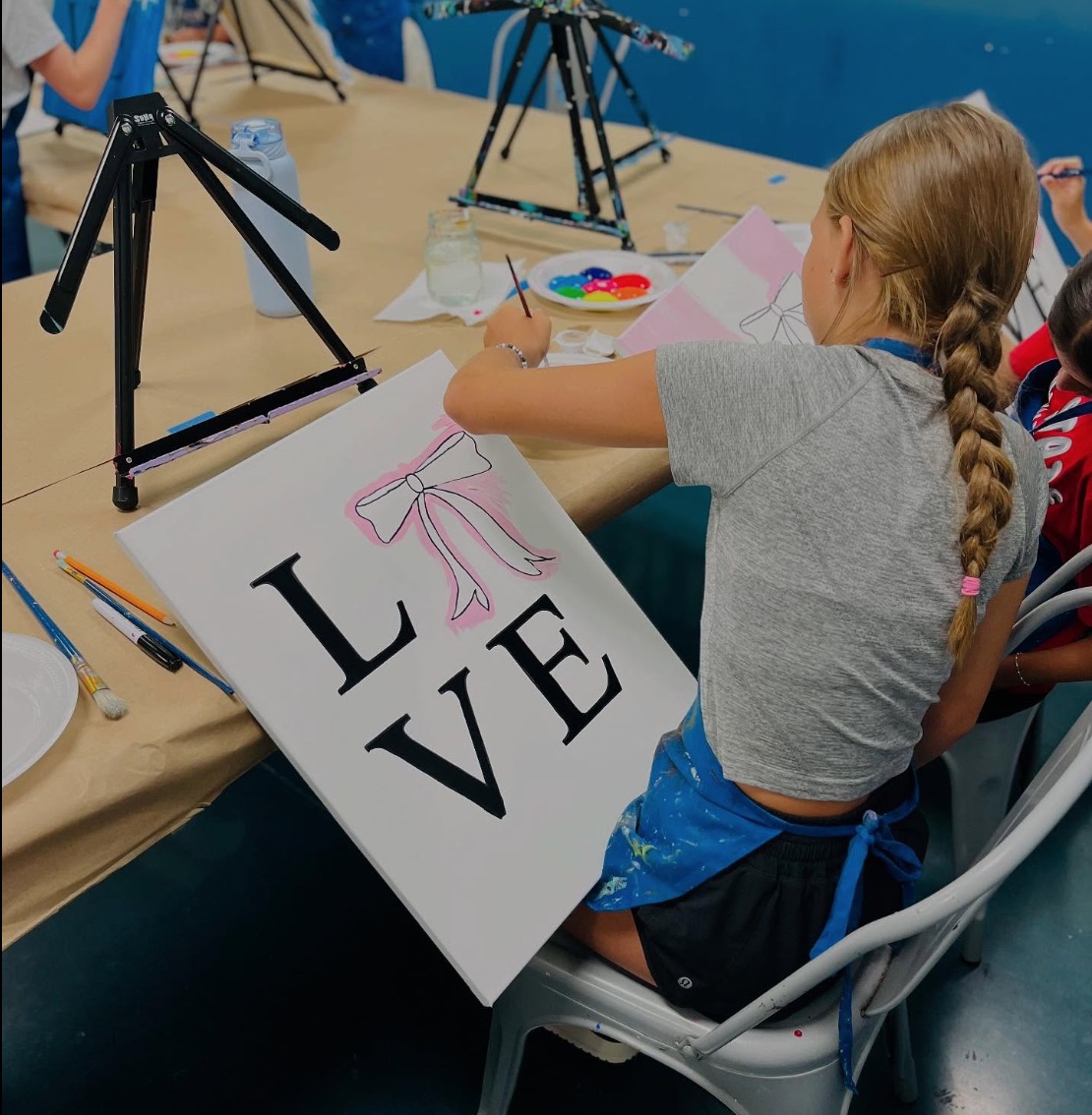 Happy kid attending summer camp in Mad splatter Apex